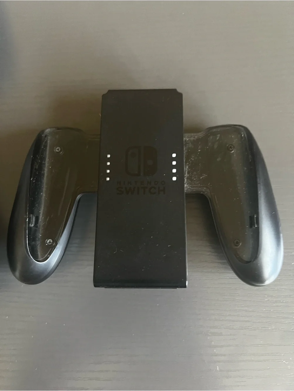 Nintendo Switch Joy-Con comfort grip and a black Joy-Con wrist strap. Used